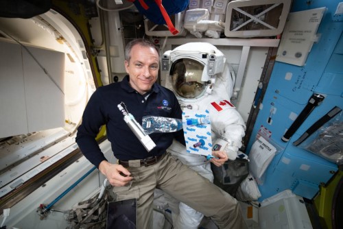 Astronaut Dr. David St-Jacques showing the materials he used to collect air samples (air sample kit; right) and to store them (metal canister, left) until they were down massed to Earth and delivered to Dr. Trudel's laboratory for analysis.